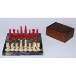 A 19th century bone Barleycorn pattern chess set, red stained opposition, the Kings 6cm high; an
