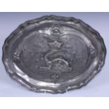 A French pewter armorial shaped oval platter, the field centred by a crowned salamander, 43.5cm
