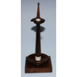 A 19th century rosewood pocket watch stand, the turned pillar with spire finial above a lotus