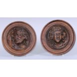 A pair of 19th century composition sculptural portrait roundels, in the Renaissance taste, oak