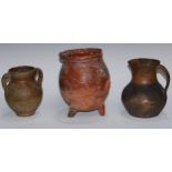Antiquities - a 16th century terracotta tripod ovoid pipkin, possibly Dutch, the grooved lip with