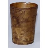 A 19th century horn and scrimshaw beaker, sgraffito engraved with a fox hunting scene, 9.5cm high,