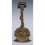 A 19th century gilt-metal door stop, cast as basket of flowers and fruit, posted handle, demi-lune