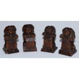 A set of four Baroque walnut carvings, as kneeling anthropomorphic lions with shields, 8.5cm high,