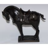 A Chinse dark-patinated equestrian bronze, of a Tang horse, cast in the archaic manner, square base,