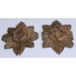 A 19th century carved softwood applique, in relief with garter star, 15.5cm long; another (2)