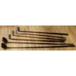 Sport, Golf - an early 20th century wood club, textured face, ebonised shaft, 109cm long; another,