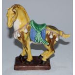 A Chinese sancai stoneware model, of a Tang horse, 14.5cm high
