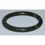 A jade bangle, 8cm diam