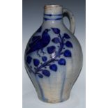A large Continental stoneware jug, decorated withA large Westerwald-type stoneware flagon, of