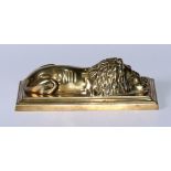 A 19th century brass rectangular desk weight, cast as a lion, stepped rectangular base, 19cm wide