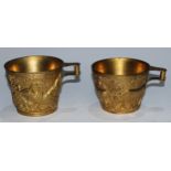 A pair of Greek gilt-copper wine cups, The Vaphio Cups, after the Ancient Mycenaean, 9cm high