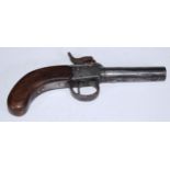 A 19th century percussion pocket pistol, 7cm barrel, foliate engraved lockplate, walnut stock,