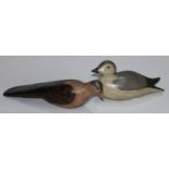 A carved softwood decoy, as a water bird, 25cm long; another (2)