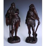 A pair of 19th century oak carvings, of Teutonic figures, one with an axe, his bearded companion