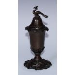 A French brown patinated bronze cup and cover, peackock finial, the base cast with water lilies,