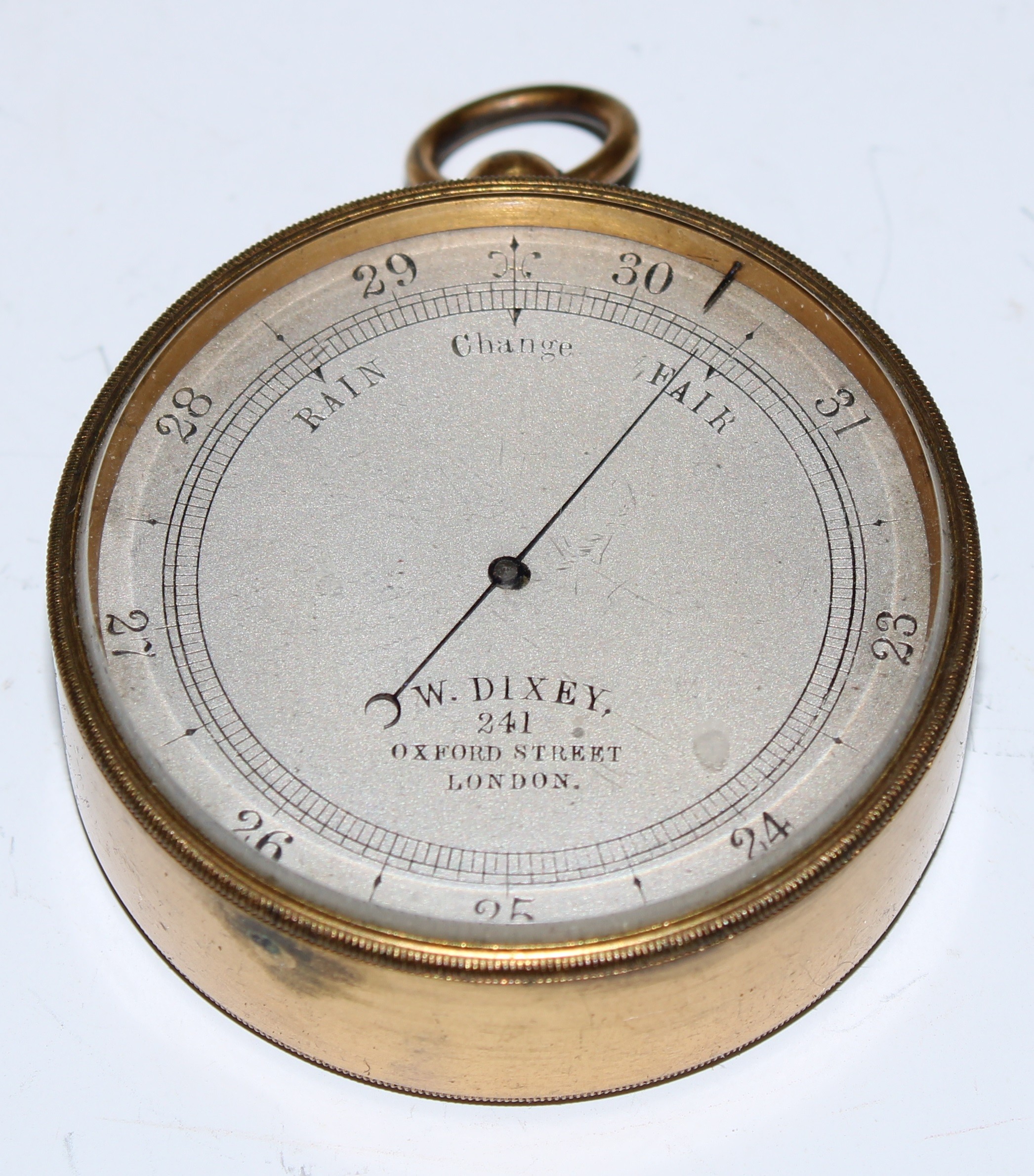 A Victorian gilt brass aneroid pocket barometer, 4.5cm silvered dial inscribed W Dixey, 241 Oxford - Image 2 of 4