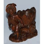 A Black Forest novelty table vesta, carved as a gardner drawing a barrow, 14cm high, c.1900