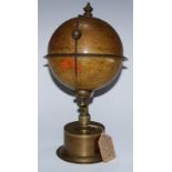 A late 19th century terrestrial globe library timepiece, The Empire Clock, patent 19460, a printed