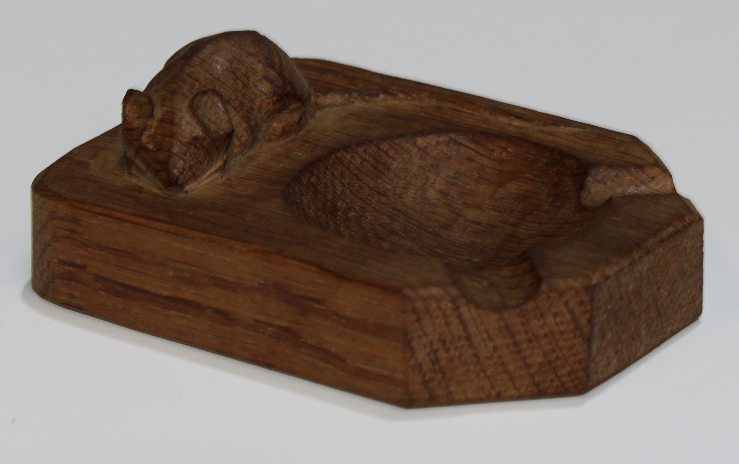 Mouseman of Kilburn - an oak ashtray, canted fore-angles, adzed overall, carved mouse signature,