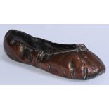 Curiosities - a bronzed copper-dipped ballet shoe, 22cm long