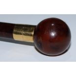 A late Victorian/Edwardian 18ct gold mounted walking stick, spherical tortoiseshell pommel,