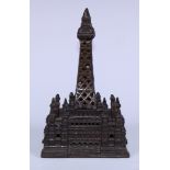 An early 20th century novelty money box, cast as Blackpool Tower, 19cm high, probably by Chamberlain