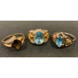 A diamond and pale blue stone dress ring, pierced floral shoulders, 9ct gold shank; another quartz