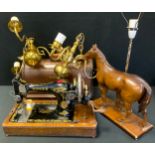 A Singer oak cased hand operated sewing machine, No F3272916; pair of brass three branch lights;