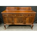 A 20th century mahogany sideboard, shaped half gallery, rounded rectangular top above one long