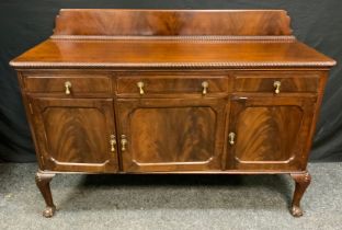A 20th century mahogany sideboard, shaped half gallery, rounded rectangular top above one long