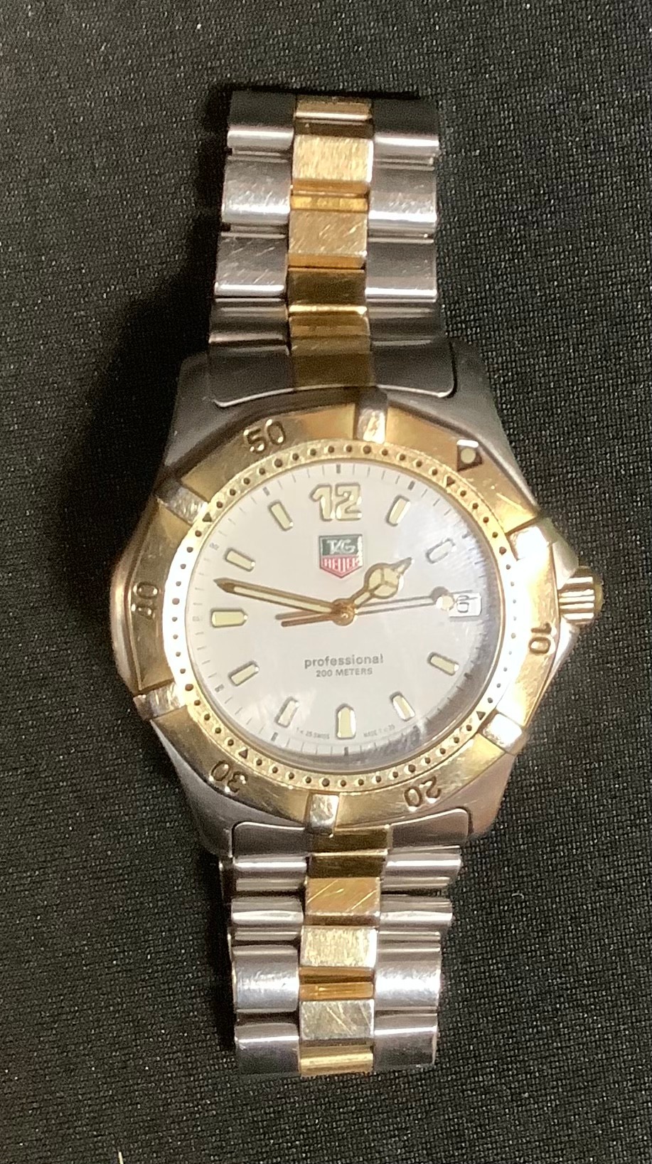 A Tag Heuer WK1120 professional 200 two tone steel cased wristwatch, serial no KY7972, cream dial,
