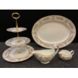 A Wedgwood Golden Columbia pattern three tier cake stand, oval meat platter, gravy boat etc