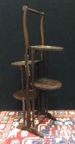 An early 20th century, four tier, collapsible mahogany cake stand, c.1920