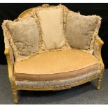 A Paul Robert upholstered love seat, Neoclassical carved arched back, upholstered in a multi tone