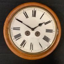 A 19th century oak station clock, enamelled white face, Roman numerals, c.1890