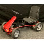 A BMW go-cart, peddle powered, plastic seat and tyres, red metal chassis, 92cm long, 56cm wide.