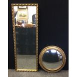 A circular convex wall mirror. textured gilt frame, 39.5cm diameter; a rectangular mirror (2)