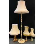 An onyx and gilt metal standard lamp, sectional shaft, plain circular base, 130cm high; other