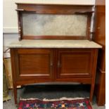 Edwardian mahogany washstand, marble rectangular top above a pair of cupboard doors, tapered