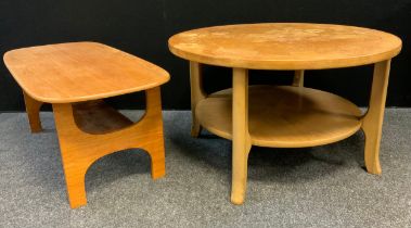 A retro mid 20th century teak circular two tier coffee table. wheel spoked top, shaped supports