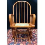 A Dutailier 20th century pine bentwood rocking chair, 100cm high