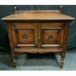 An Art & Crafts small oak sidetable, half gallery, rectangular top above a pair of cupboard doors,