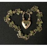 An Irish green stone and 9ct rose gold shamrock pattern bracelet, stamped 9ct, 9.4g gross.