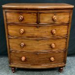 A Victorian mahogany chest of drawers, bow-front top above two short and three long graduated