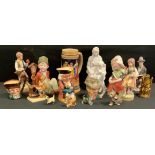 A pair of Heubach figures 'Girl and Boy'; a pair of Royal Doulton small toby jugs 'Old Charley'