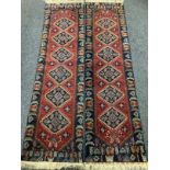A pair of Mid 20th century Middle Eastern, Hamadan type, Runner Carpets, hand knotted in shades of