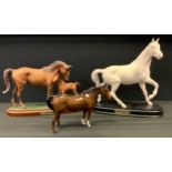 A Royal Doulton model Horse, First Born, matt, plinth base, others Spirit of the Wind etc (3)