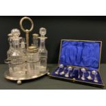 An early 19th century silverplated 6 bottle cruet stand, cut glass bottles, cased set 6 ESPN
