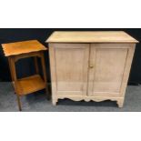 A Victorian pine cupboard, rounded rectangular top, pair of panelled doors enclosing shelving,